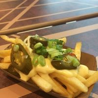 Fries with jalapeños & cheese at Vedang - green burger | Alexa in Berlin