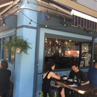 Outside of restaurant (with reflection of the other side of the street) at Petisco Vegano in New York City