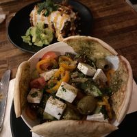 Enchilada with Greek salad at Petisco Vegano in New York City