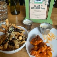 Cauliflower wings and loaded fries  at Watercourse Foods in Denver