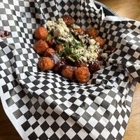 Sweet Potato Tots with Vegan cheese  at Watercourse Foods in Denver