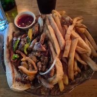 Vegan Philly cheesesteak with fries at Watercourse Foods in Denver