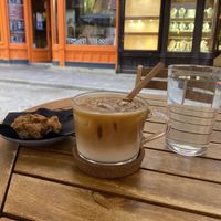 iced latte with oat milk and a vegan chocolate chip cookie at Melt Cafe in Zagreb