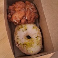 apple fritter and pistachio rose donut at bloomer's in Toronto