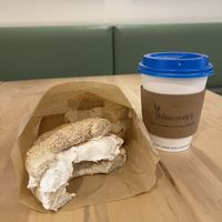 Sesame bagel with house made “cream cheese” and a latte   at bloomer's in Toronto