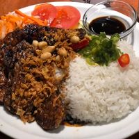 Dau Hu; black soy tempeh, with rice  at MeMe Vietnamese Food in Rotterdam