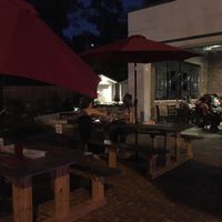 Multiple picnic tables set up for outdoor seating at Utah Station in St Louis