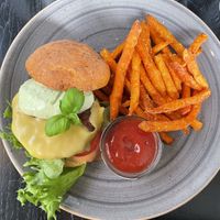 Vegan burger with sweet potato fries  at Kivi Paber Käärid in Tallinn