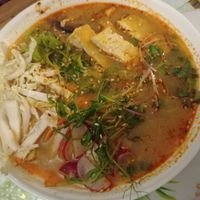 Tom yum soup with tofu, greens, noodles, cabbage and other vegetables at Dobrá Cajovna in Kutna Hora