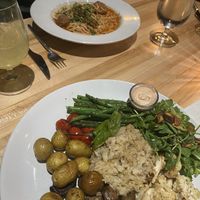 Vegan bowl and vegan spaghetti in background   at Vin'tij in Miramar Beach