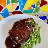 This was on a special holiday menu. Meati Steak with a Vegan/Organic Red Wine Sauce, New Potatoes and Green Beans Vegan & GF.  at Vin'tij in Miramar Beach