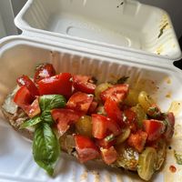 Tostada en pan de masa madre con mix de tomates, queso vegano de anacardos y pesto  at The Fix Specialty Coffee in Madrid