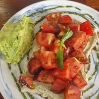 Tostada con mix de tomates, queso vegano de anacardos y pesto at The Fix Specialty Coffee in Madrid