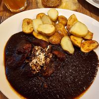 Black beer goulash (the vegan version has potatoes bc the dumplings aren't vegan) at Maitrea in Prague