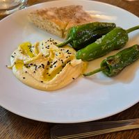 Appetizer - Hummus with Padron peppers and bread at Maitrea in Prague