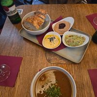 Selection of appetizers with bread at Maitrea in Prague