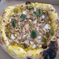 Pumpkin & wild garlic: with pumpkin cream, homemade cashew mozzarella, wild garlic burger chunks, oyster mushrooms & fresh basil at Plant A Pizza in Ghent