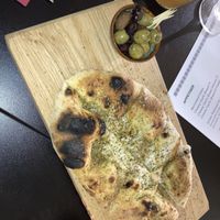 Cheesy garlic bread & olives  at Plant A Pizza in Ghent