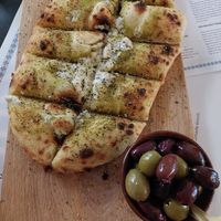 Garlic bread and olives at Plant A Pizza in Ghent
