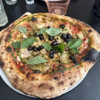 The Med. Tomato sauce, cashew mozzarella, olive mix, marinated artichokes, oregano, fresh basil  at Plant A Pizza in Ghent