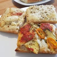 Quarters of different pizzas - Detroit style at Plant A Pizza in Ghent