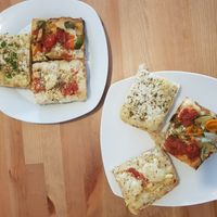 Quarters of different pizzas - Detroit style at Plant A Pizza in Ghent