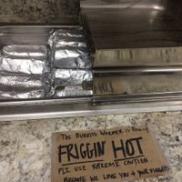 Friggin' HOT is no joke! Grab a paper napkin for insulation before you go in, then use it to wipe your messy face. at Mountain Avenue Market in Fort Collins