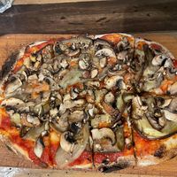 Funghi pizza with no mozzarella and aubergines added instead   at Sotto Pizzeria in Valletta