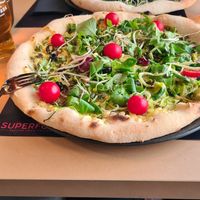Vegan pizza with courgette 'spaghetti 'with sheese and  salad. A really big bizza! at Superfood Healthy Food Factory in Split