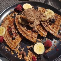 Blueberry waffle with chocolate ice cream and fruit 😍 at Plantd in Windhoek
