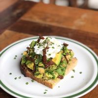 Avocado, Chickpea and Sun-dried Tomato Toast with optional poached eggs  at Pilgrim in Kampot
