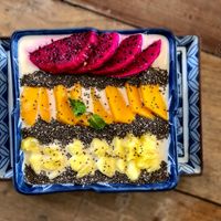 Tropical Chilled Oatmeal. Soaked overnight in coconut milk, topped with fresh fruit & chia seeds at Pilgrim in Kampot