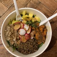 salad w/ greens, quinoa, lentils, mango, radish, &roasted pumpkin at Base V Juicery - Via dei Neri in Florence