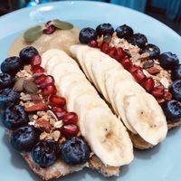 Home made Peanut Butter Toast with fresh fruit and home made Granola....... at Go Vegan Cafe in Phuket