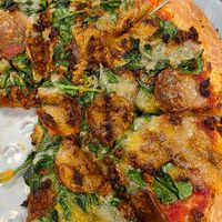 Vegan pepperoni, v sausage, v cheese, spinach at Jim's Razorback Pizza in Fort Smith