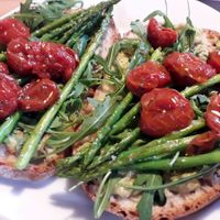 Tostas de aguacate, trigueros, rúcula y tomates cherry at A Morena in Lugo
