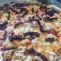 Delicious Thai Pizza at Mega Hea Pizza in Tallinn