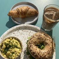 Egg salad bagel, scrambled tofu, chocolate croissant, iced coffee  at Plant Base in Berlin