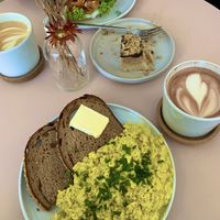 Scrumbled tofu, snickers cake, bagel with salmon and hot chocolate 😋  at Plant Base in Berlin
