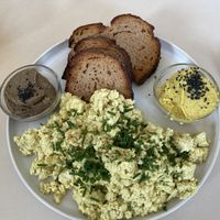 Tofu scramble (option two with more bread and two spreads)  at Plant Base in Berlin