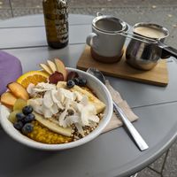 Golden milk style porridge and dirty chai latte at Plant Base in Berlin