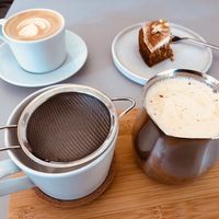 Chai latte, flat white, carrot cake at Plant Base in Berlin