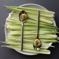 *Grass - Corn Custard, Crispy Garlic, Basil, Black Truffle. One Dish from the 13-Course Tasting Menu. at ēst in Toronto