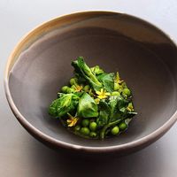 *Legumes - Shucked peas cooked in pea shell juice, crushed shallots, fried wasabi and seaweed, garnished with blackened pea tops, fresh lemon and lovage oil. Vegan Tasting Menu. at ēst in Toronto