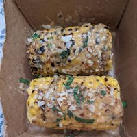 Elote - I don't know what the toppings are but they are yummy! at Vegos in Albuquerque