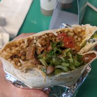 Seitan burrito, hand-held with both Chiles rojo and verde at Vegos in Albuquerque