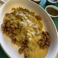 Cheesy rice and beans with sour cream, red and green chili sauce   at Vegos in Albuquerque