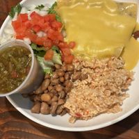 Enchilada plate with tofu. Green chili sauce on side. Rice with a bit of a kick for the 80 plus year old.😄 at Vegos in Albuquerque