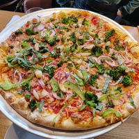 Large pizza with vegan cheese, broccoli, red onion, peppers, garlic, and basil at Piecasso in Stowe
