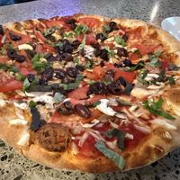 Tomato, basil, mushrooms, kalamata olives and vegan cheesee  at Piecasso in Stowe